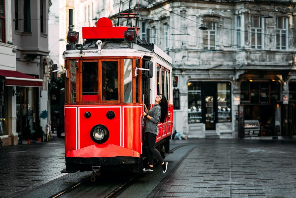 Girl in a vintage tram on the Taksim Istiklal street in Istanbul. Girl on public transport